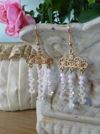 Each earring has seven delicate swarovski crystals and three large crystals set with pink glass beads strung to a filigree mount. Price: &pound;24.68